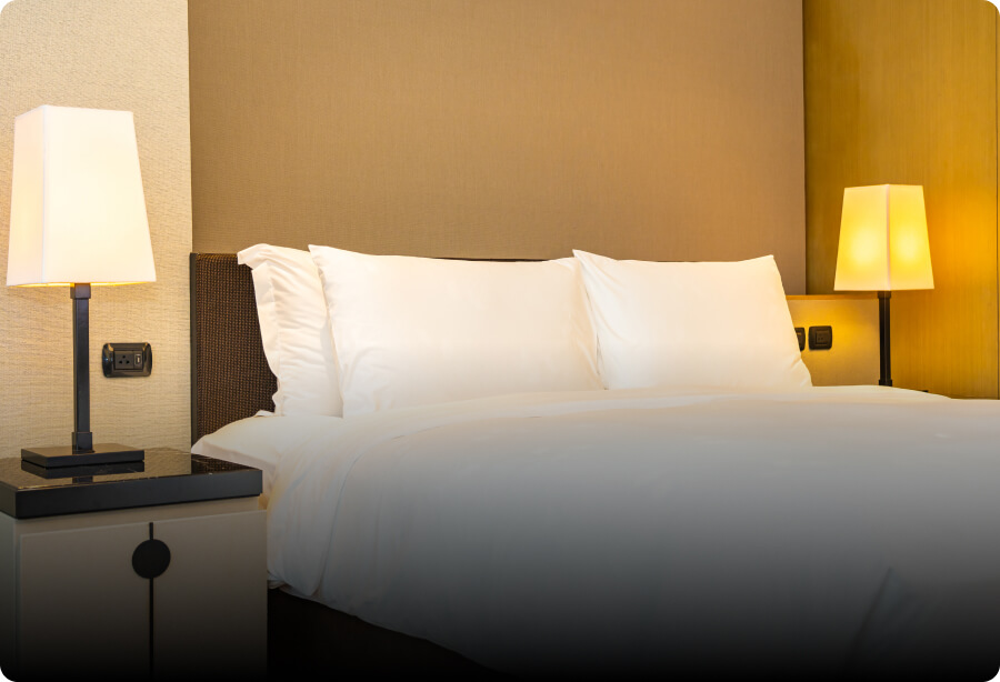 A hotel room with a double bed